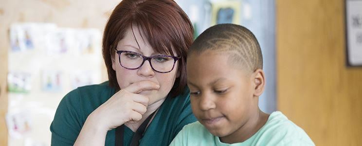 Teacher helping a student Teacher helping a student